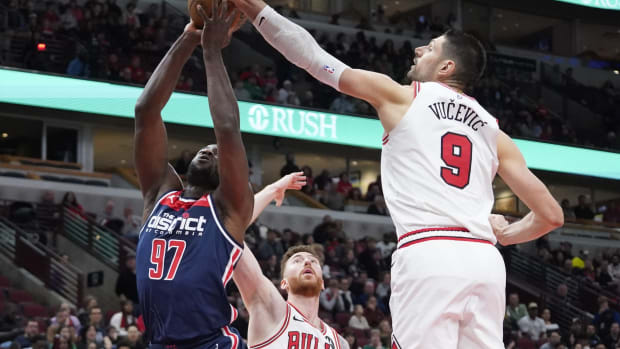 Chicago Bulls center Nikola Vucevic (9) defends Washington Wizards forward Eugene Omoruyi (97) during the second half at United Center.